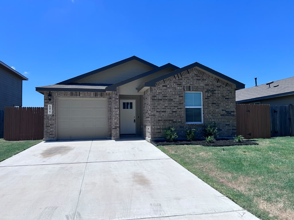 Brick home representing the San Antonio housing market